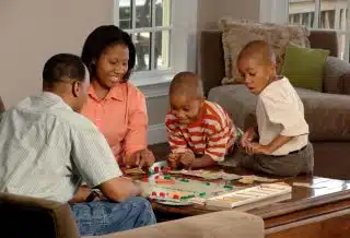 family playing board games